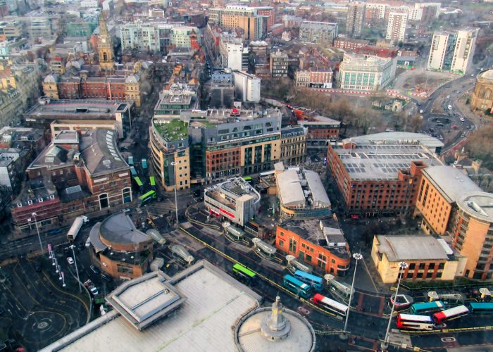 Aerial view of the Liverpool from a view point, United Kingdom. Old and modern buildings, bare trees and cloudy weather